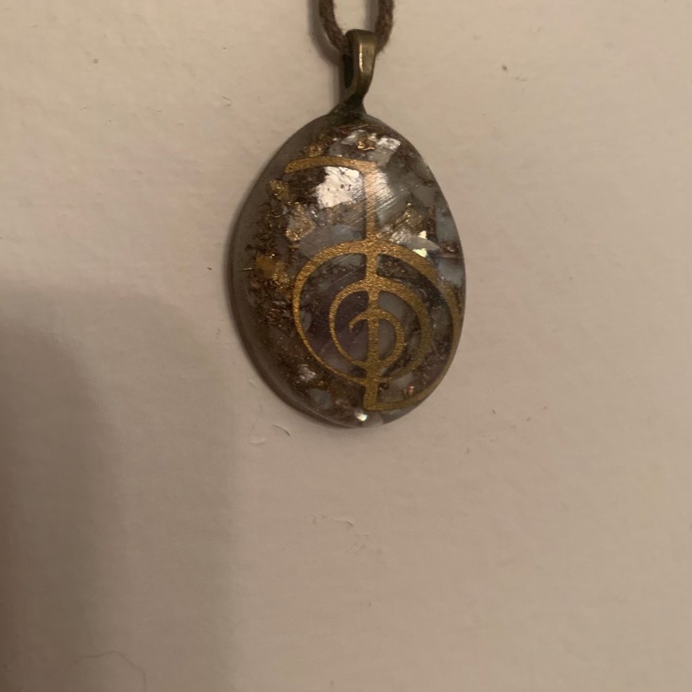 "RA" necklace on leather cord